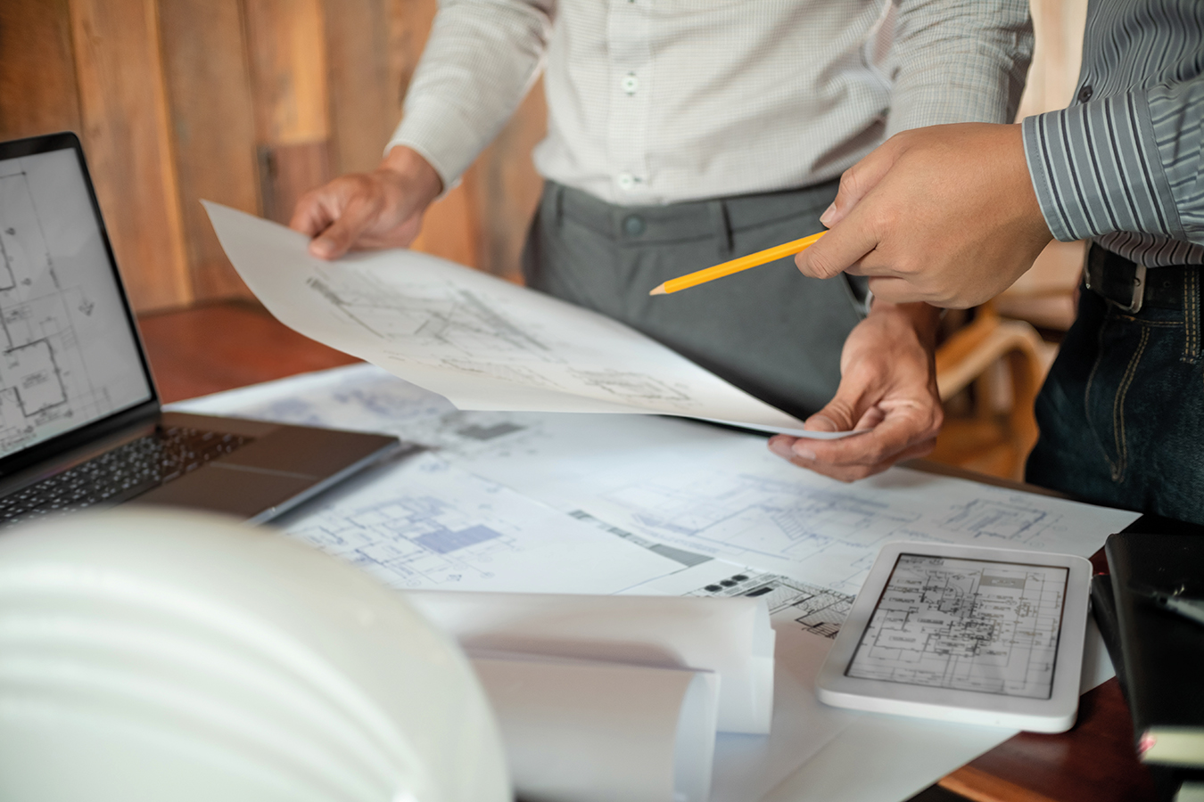 Architects interior designer hands working with Blue prints and documents for a home renovationÂ for house design